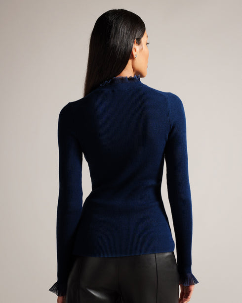 DVANA-Knitwear-For a frilling addition to your smart-casual wardrobe, add DVANA to your style repertoire. Not any ordinary knit, this ribbed jumper is given a little extra in the form of a frill detailing on the neckline and sleeves. Fitted jumper Cashmere blend High neck Long sleeves Frilled trims Ribbed knit- Ted Baker Romania